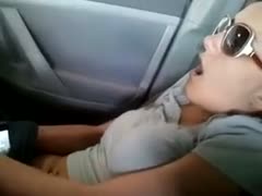 My girlfriend is not patient at all, and she starts masturbating in the car.